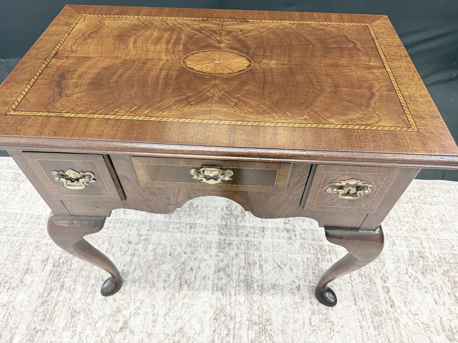 Top view of the Councill Craftsmen lowboy showing the satinwood fan inlay and crossbanding