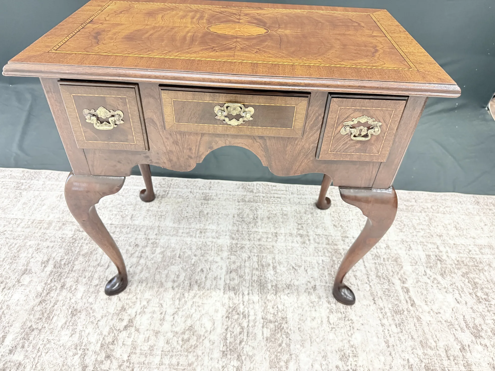 Elevated view of the Councill Craftsmen lowboy showing the inlaid top and Queen Anne form
